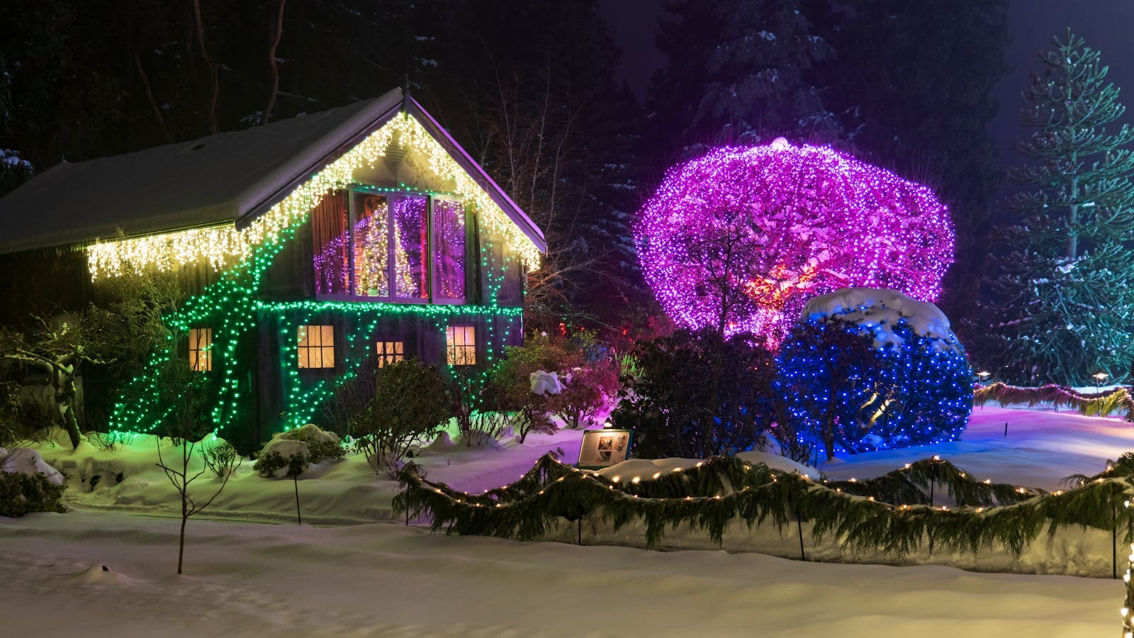 Sacramento home roofline lit with permanent holiday lighting controlled by a smartphone app, no ladder required