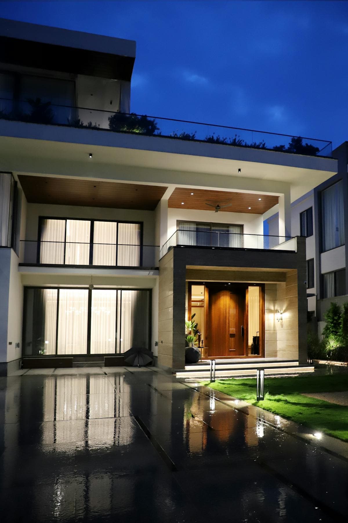 Sacramento home illuminated by permanent outdoor LED lights on a hot summer evening, showing roofline lighting performance during extreme heat