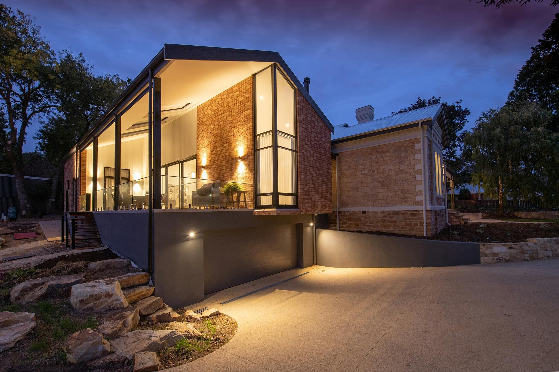 Modern Sacramento home exterior with warm LED lighting along the roofline at dusk, demonstrating how permanent outdoor lights transform curb appeal