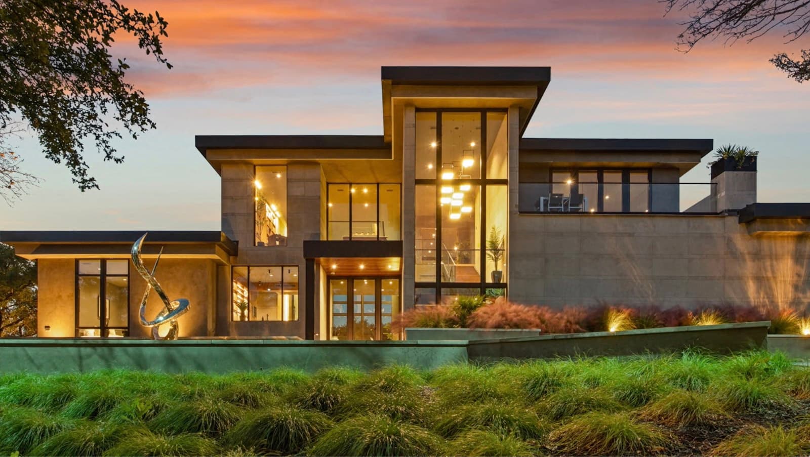 Two-story Yolo County home at dusk with permanent outdoor LED lights running along the entire roofline and gables in warm white — the kind of facade common in Wildhorse Davis, downtown Woodland, and the Bridge District in West Sacramento