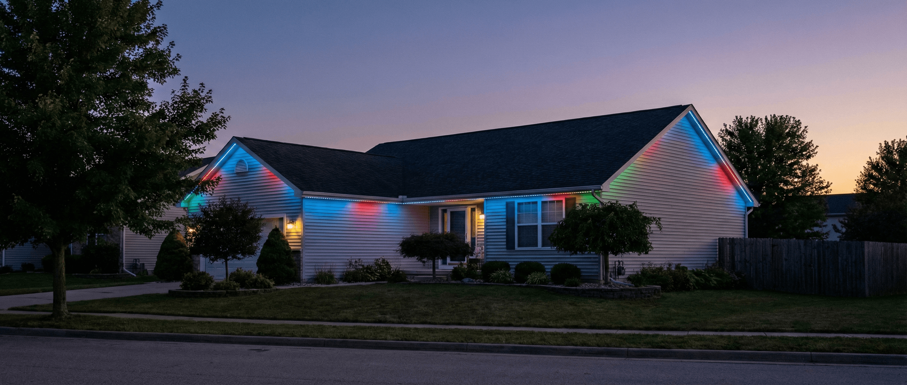 Ranch home with rainbow multicolor eave and landscape lighting